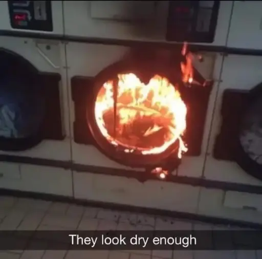 A picture of a burning dryer. The caption says "They look dry enough"